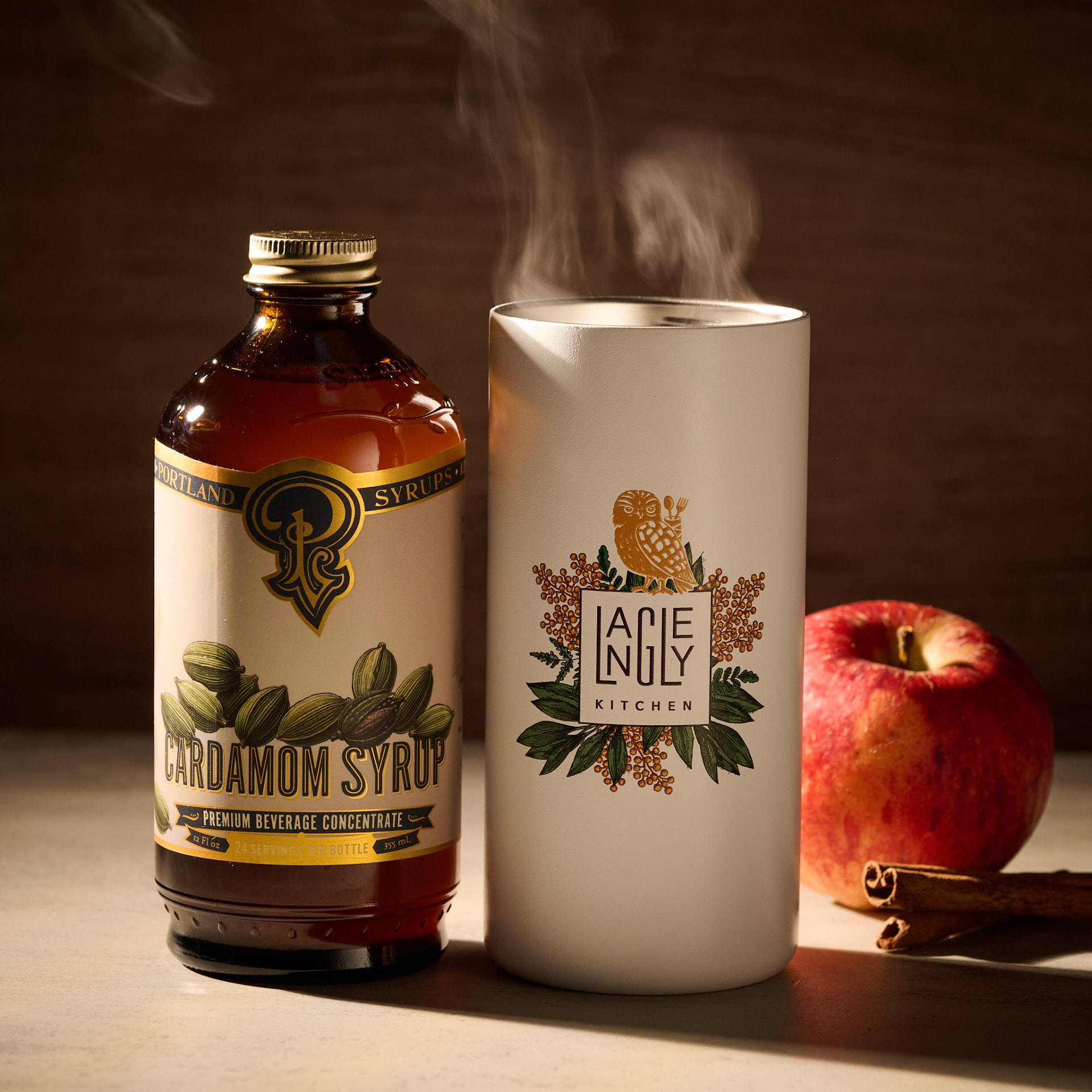 Warm cardamom apple cup cocktail with cinnamon