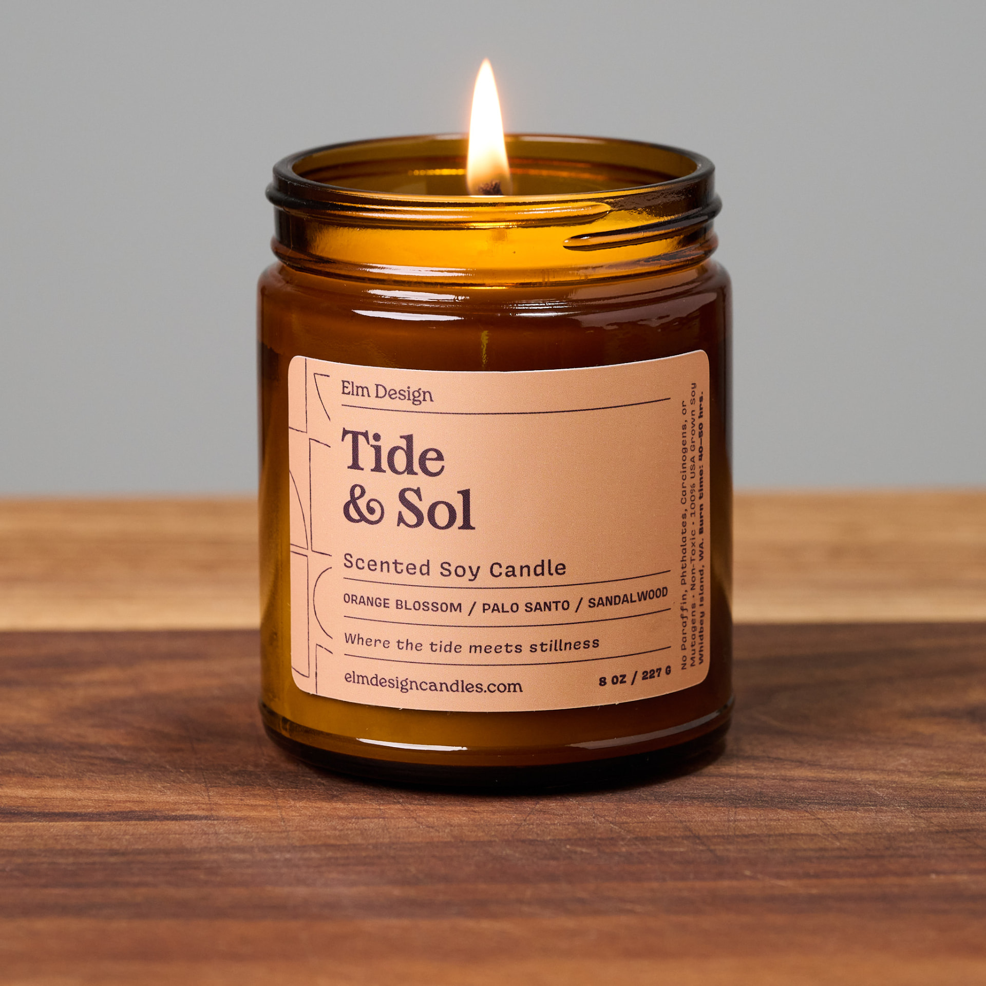 Tide & Sol scented soy candle in amber glass