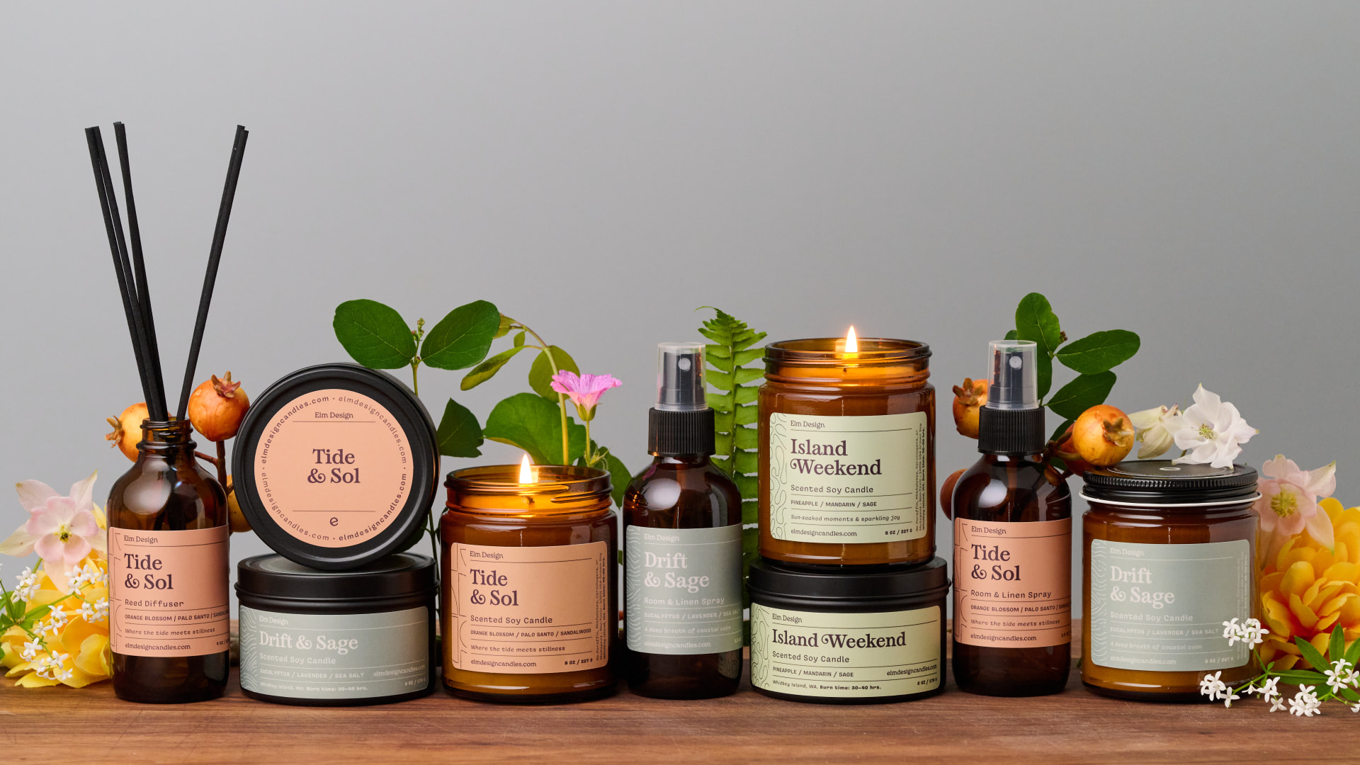 Elm Design candle, diffuser, and room spray collection styled with flowers